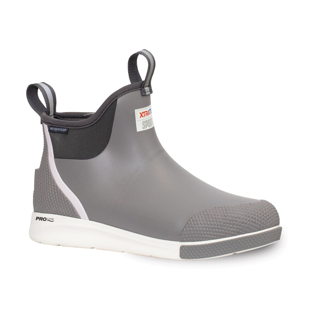 Grey Xtratuf Ankle Deck Boot Sport with white sole, slip-resistant texture, and pull tabs.