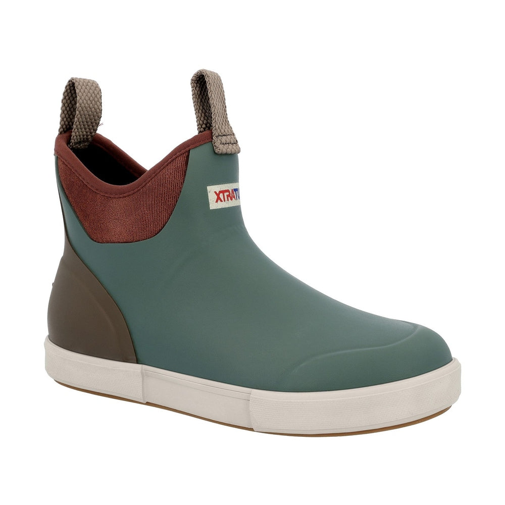 XTRATUF Ankle Deck Boot in green with brown trim, pull tabs, and white slip-resistant sole.