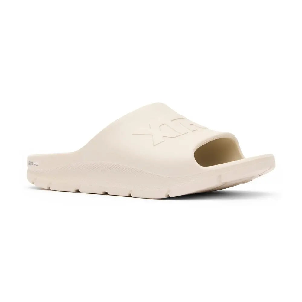 Light beige Apres Fish slide sandal with "XTRATUF" embossed on the strap and "BIO" on the heel.