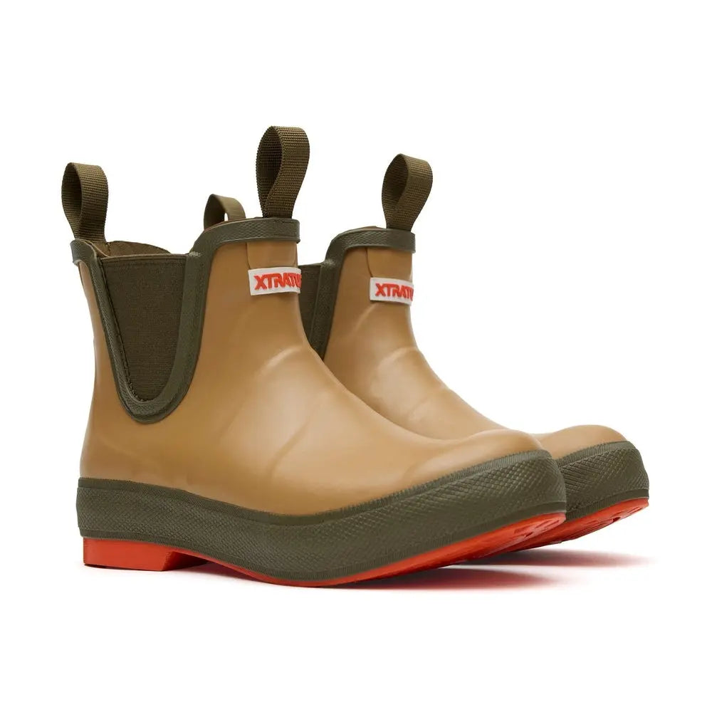 Tan Legacy Deck Boots with olive green trim, pull tabs, and orange soles.
