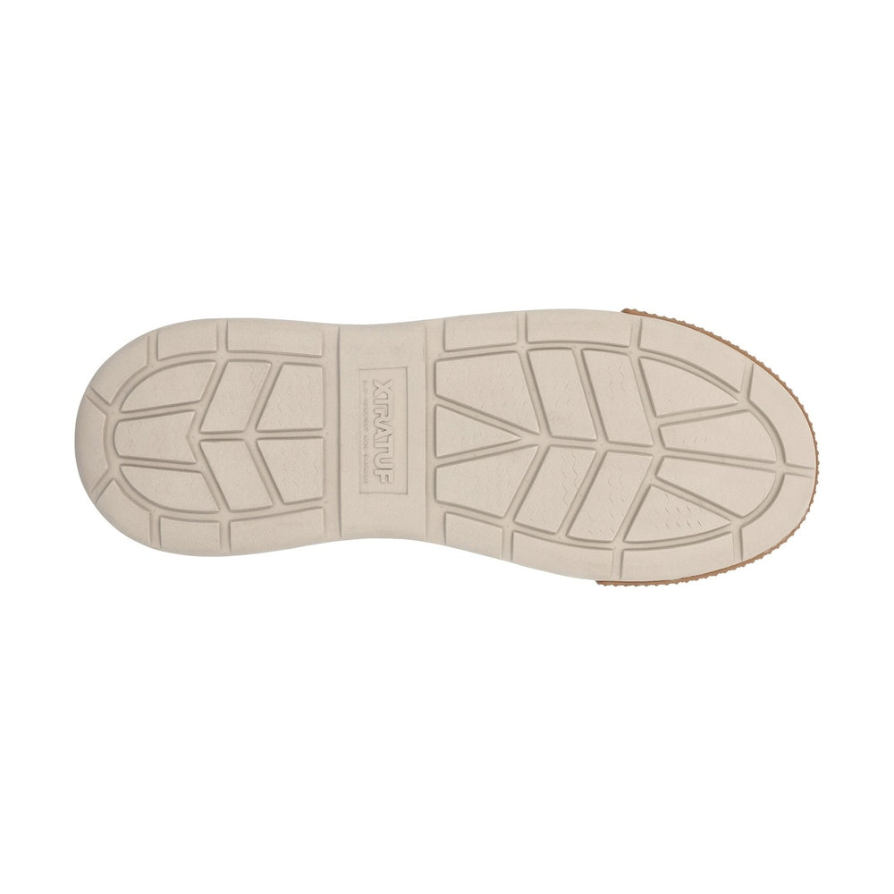 Bottom view of a beige XTRATUF Ankle Deck Boot Sport sole with textured traction patterns.