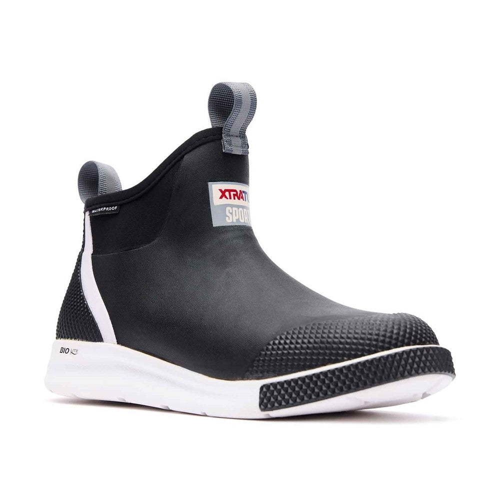 Black XTRATUF Ankle Deck Boot Sport with white sole, textured toe, and pull tabs.