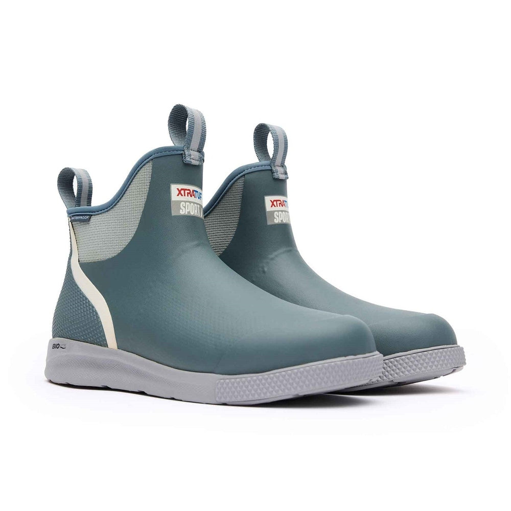 Pair of blue-grey XTRATUF Ankle Deck Boot Sport with light grey soles and pull tabs.