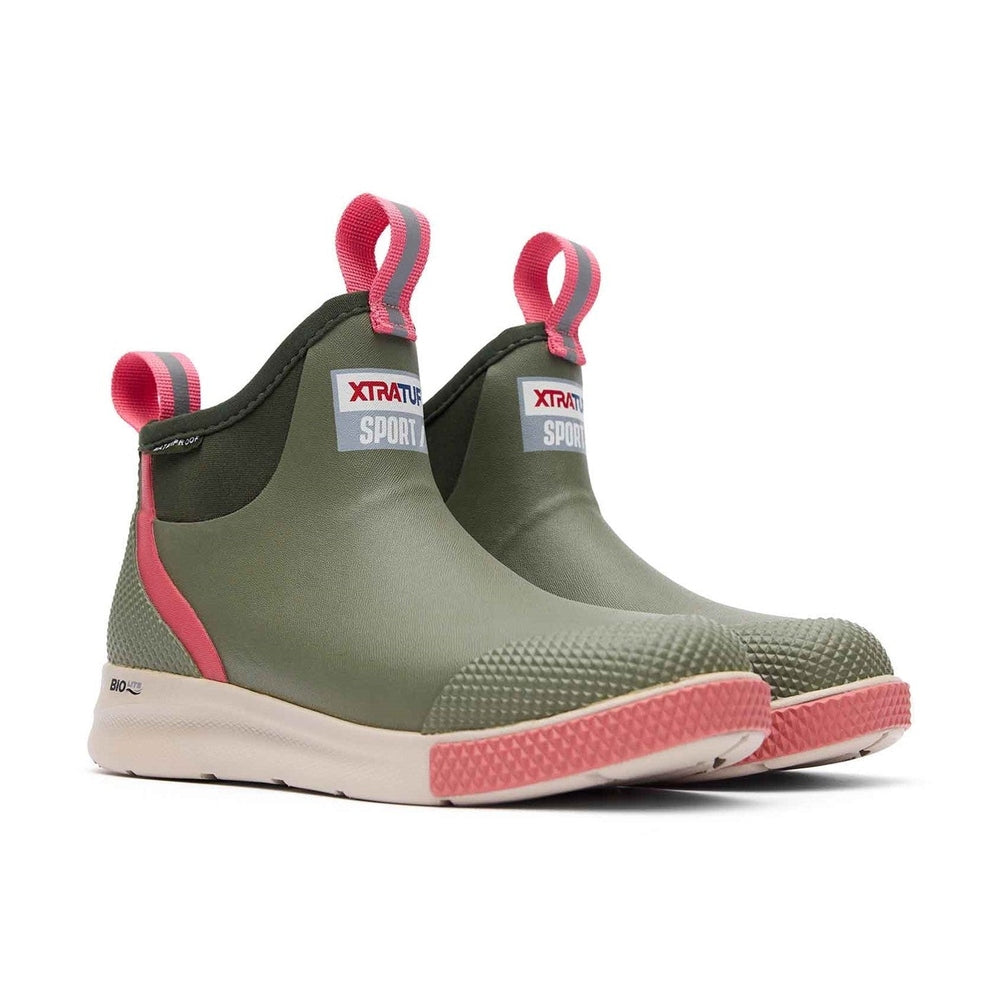 Pair of olive green XTRATUF Sport ankle deck boots with pink accents and white soles.