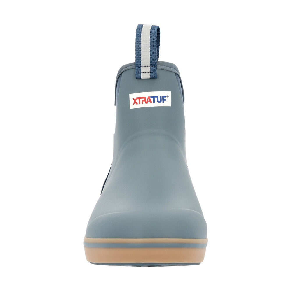 XTRATUF Ankle Deck Boot in slate blue with a tan sole and blue and white pull tab.