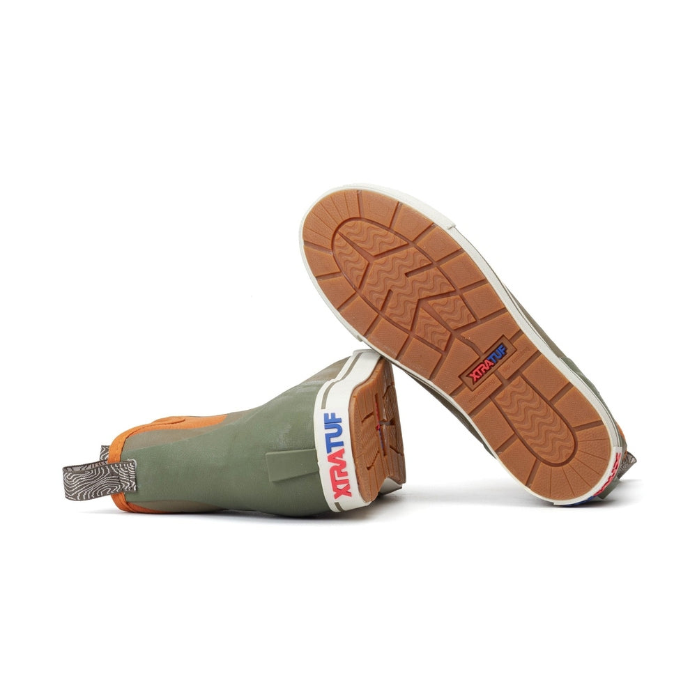 Green and orange XTRATUF Ankle Deck Camp Boots with brown non-slip soles.