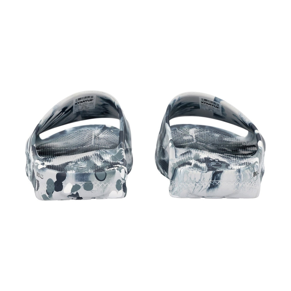 Pair of Apres Fish slides in a gray and white camouflage pattern, showing the lightweight, one-piece design.