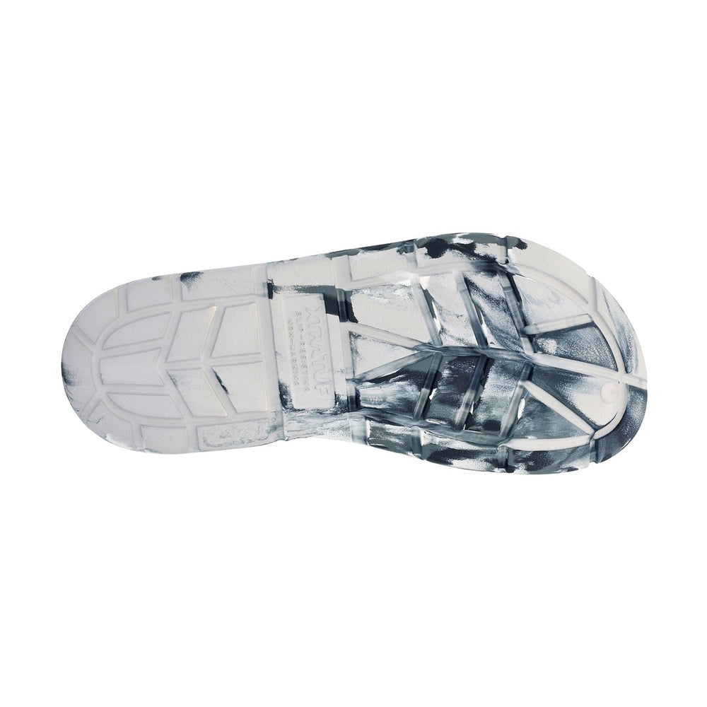 Apres Fish Slide outsole, white and black marbled eco-conscious material with slip-resistant traction.