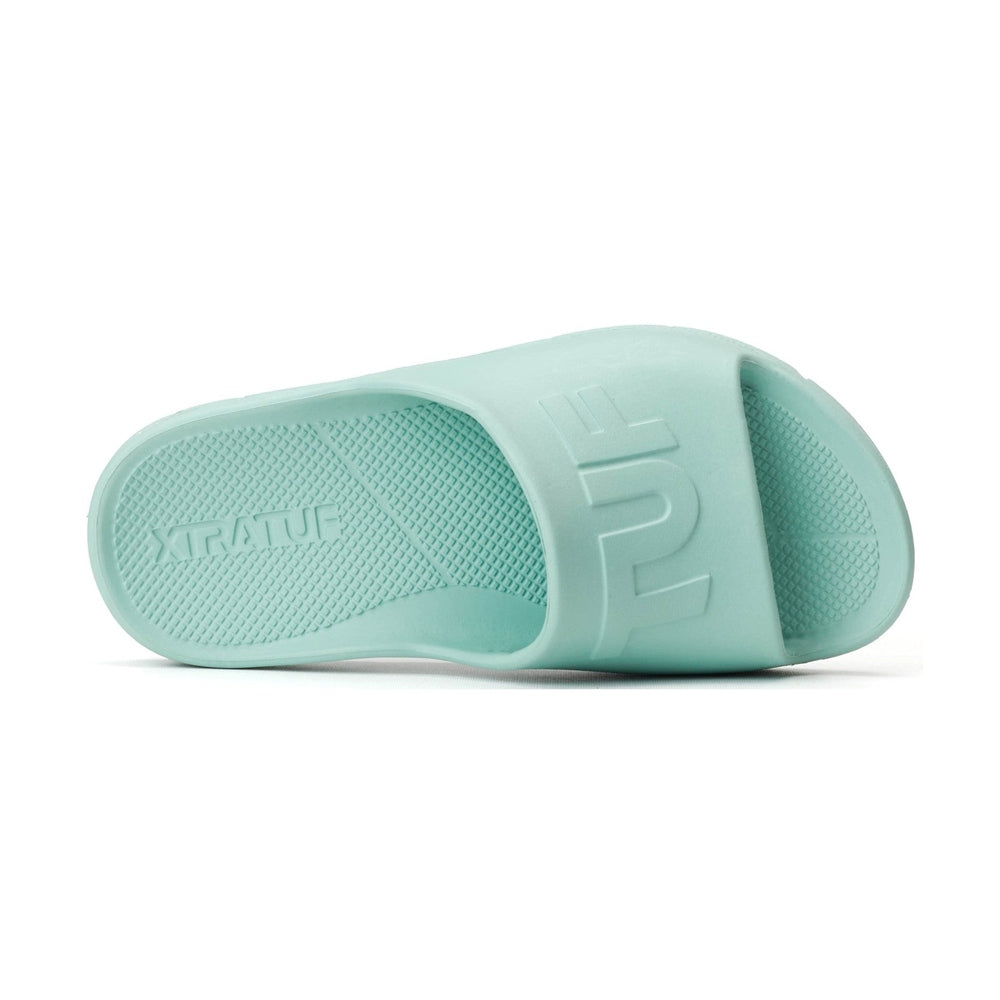 Mint green Apres Fish slide sandal with "XTRATUF" on the heel and "TUF" on the strap.