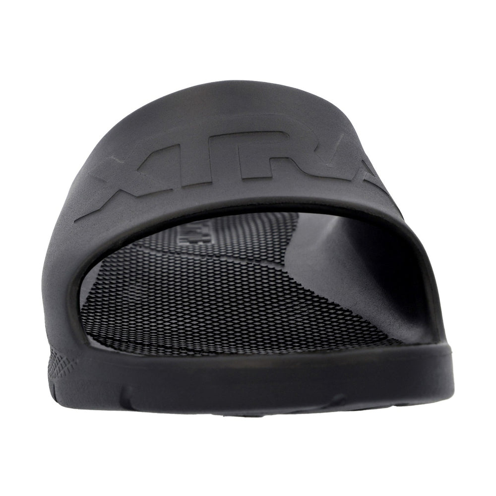 Black Apres Fish slide sandal with textured footbed and "TRA" embossed on the strap.