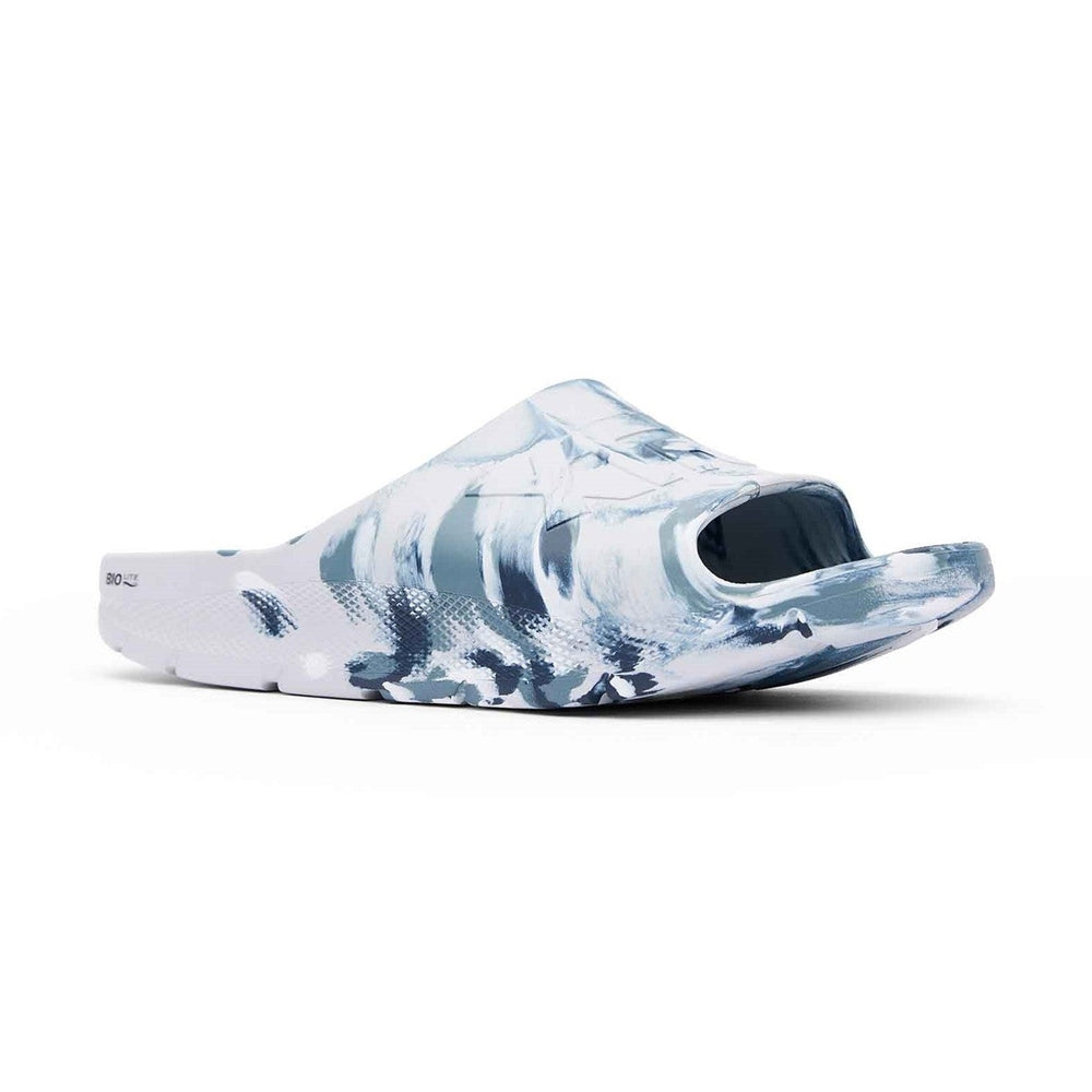 Apres Fish Slide: White and blue marbled eco-conscious slide with a wide strap and textured outsole.