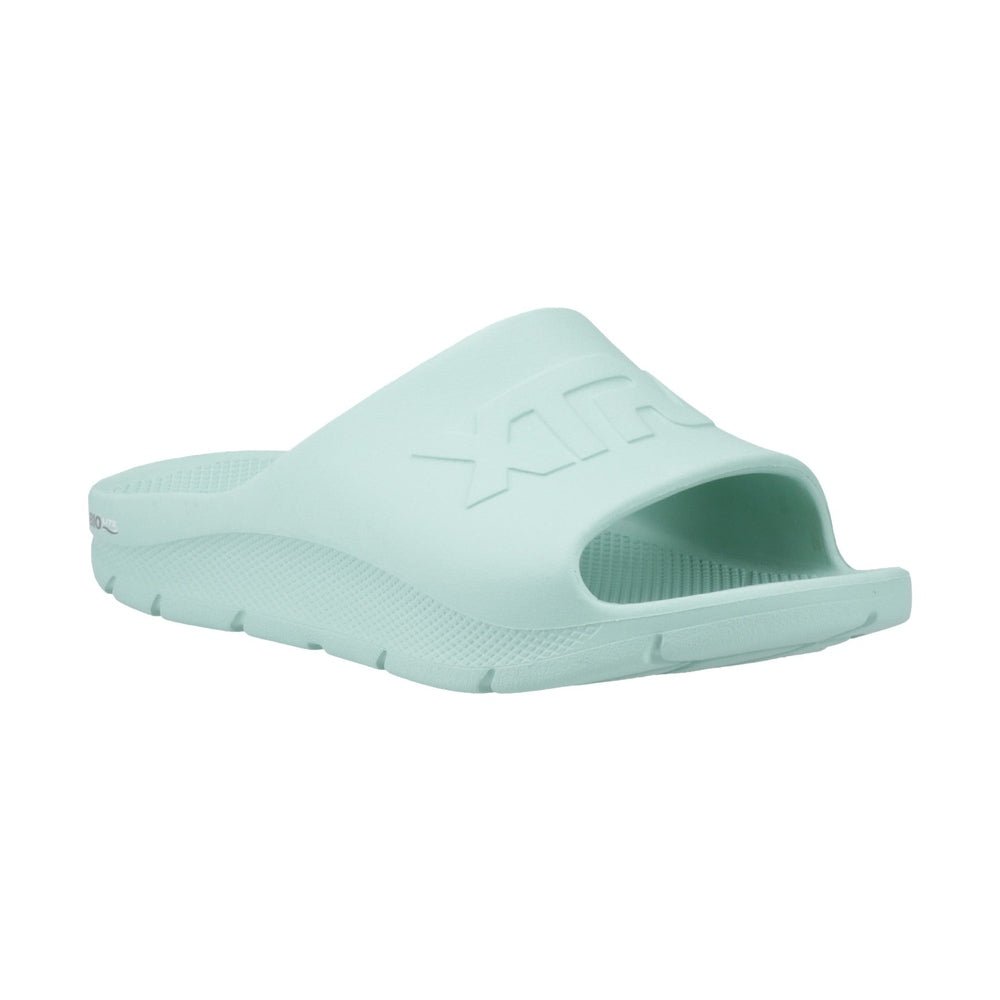 Light green Apres Fish slide sandal with textured sole and "XTRATUF" logo on the strap.