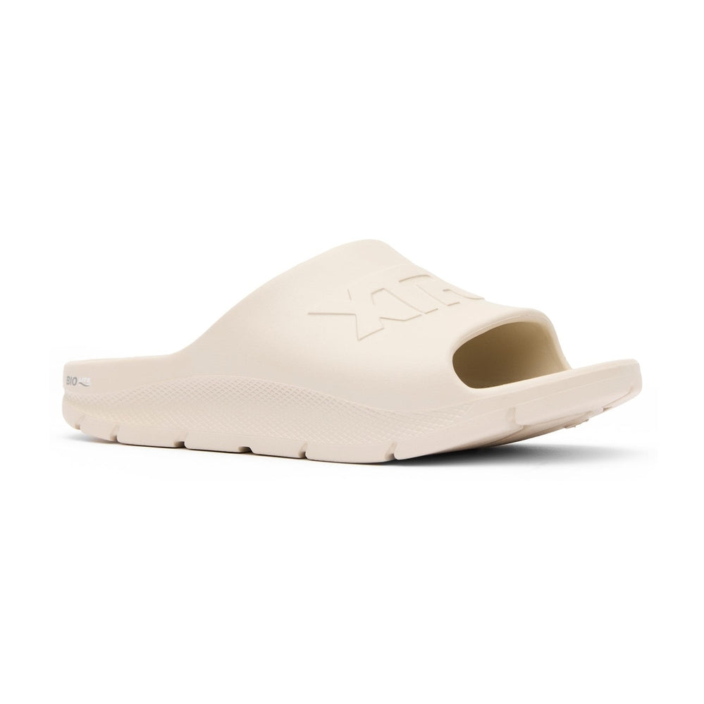 Light beige Apres Fish slide sandal with "XTRATUF" embossed on the strap and "BIO" on the heel.