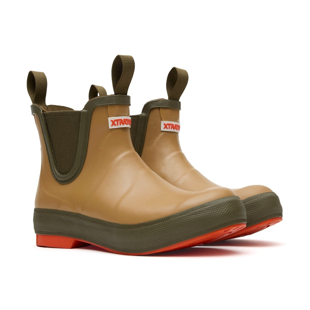 Tan Legacy Deck Boots with olive green trim, pull tabs, and orange soles.