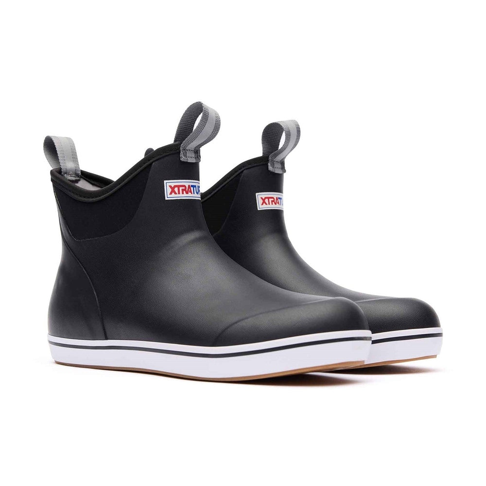 Women's Xtratuf Ankle Deck Boots in black with white soles and gray pull tabs.