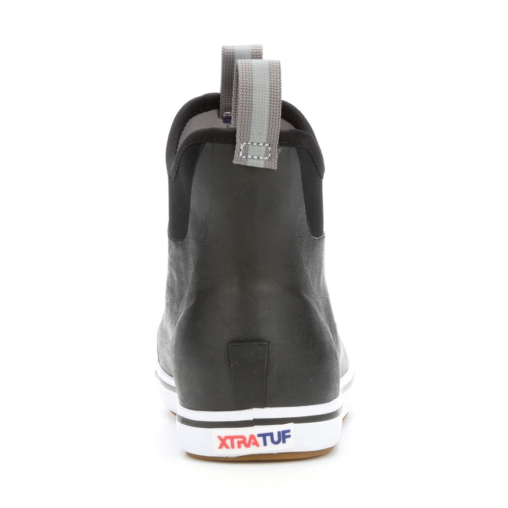 Black Xtratuf Ankle Deck Boot with grey pull tab and white slip-resistant Chevron outsole.
