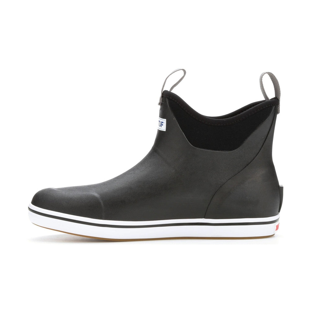 Black Xtratuf Ankle Deck Boot with white sole, gray pull tabs, and blue logo.