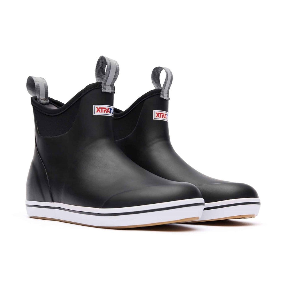 Pair of black Xtratuf Ankle Deck Boots with white soles, grey pull tabs, and red logos.