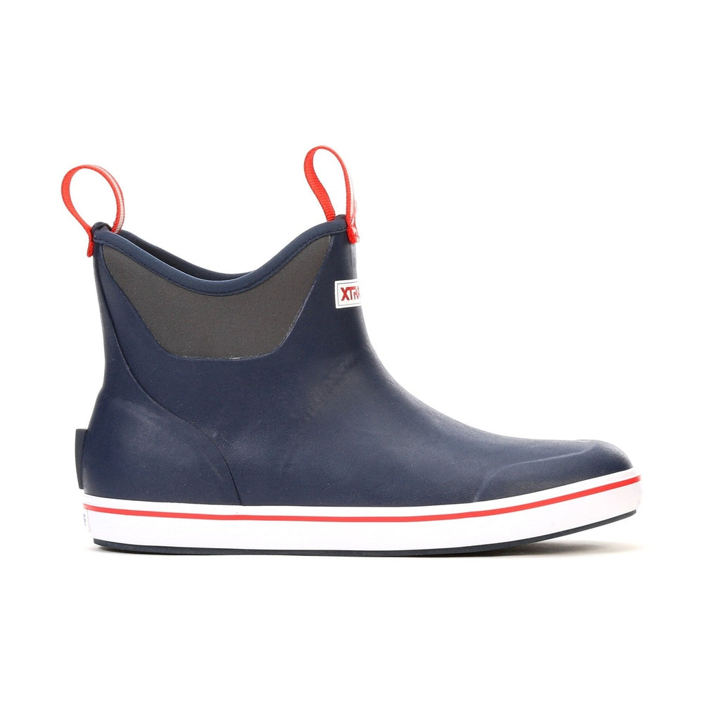 Navy Xtratuf Ankle Deck Boot with red pull tabs, a white sole with a red stripe, and a dark gray ankle collar.
