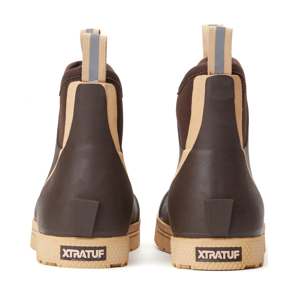 Pair of brown Xtratuf Wheelhouse Deck Boots with tan soles and pull tabs, seen from the back.