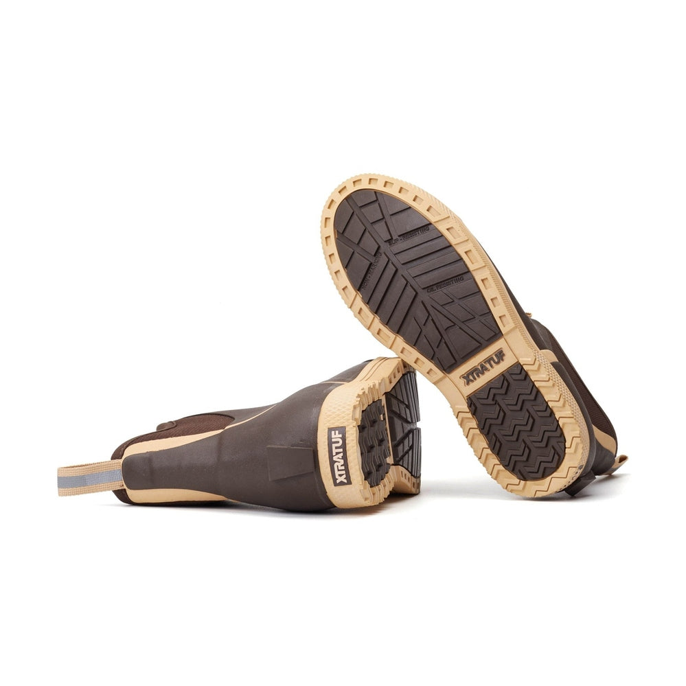 Brown Xtratuf Wheelhouse Deck Boots, showing tan soles with deep treads and pull tabs.